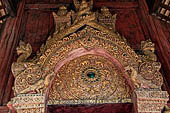 Chiang Mai - The Wat Phra Singh temple. Detail of the entrance door of the ubosot (ordination hall). 